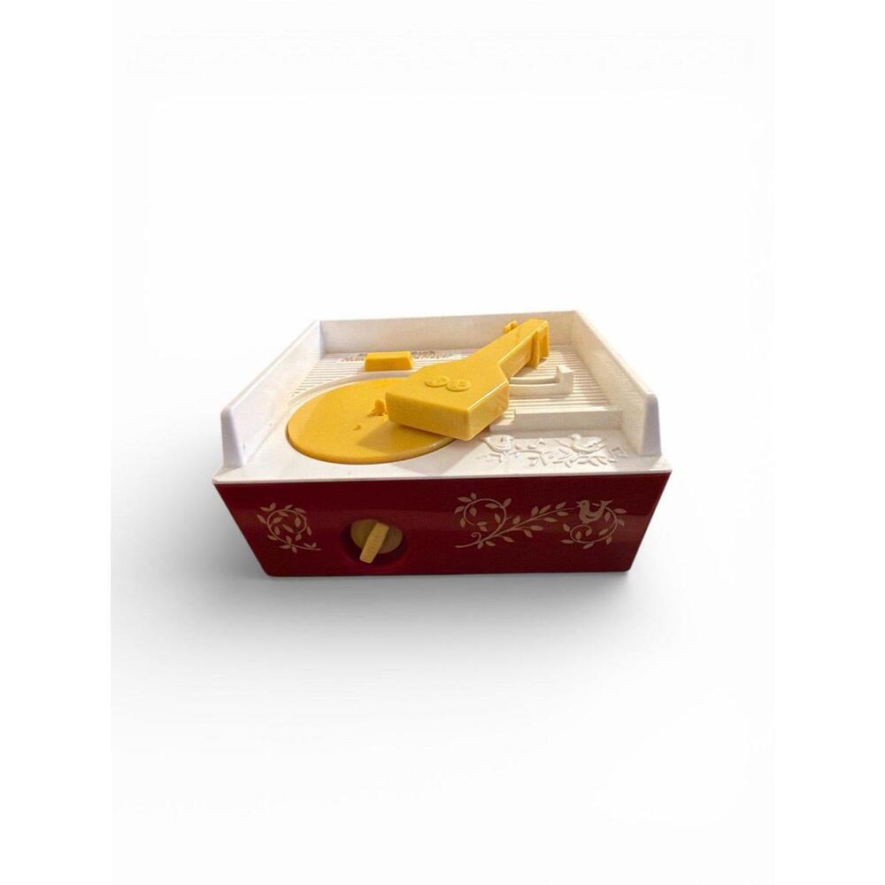 Vintage It is a toy music box that plays songs from special plastic records. 
It